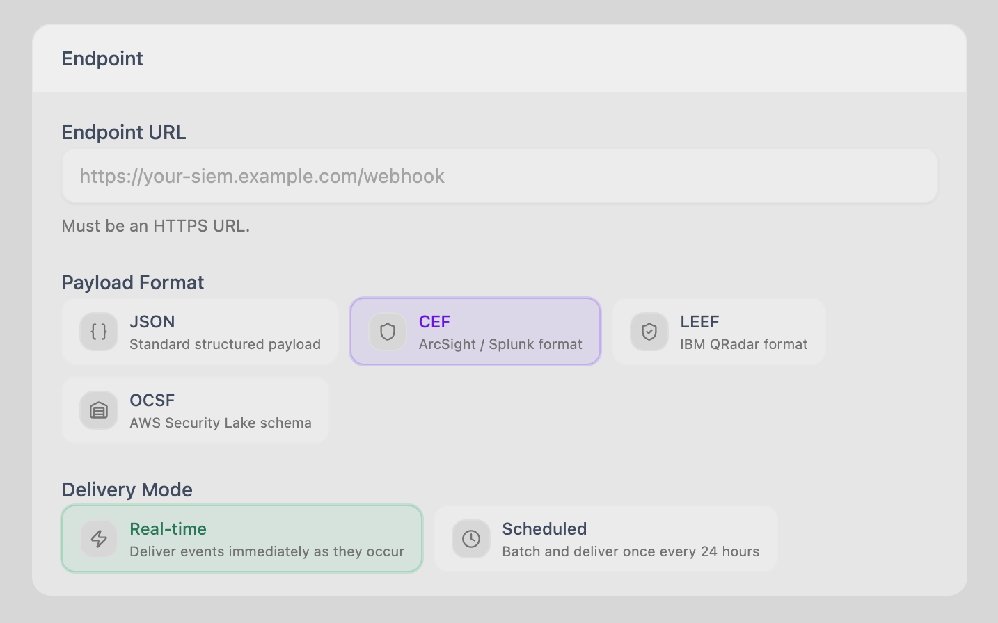 Trustaige audit webhook configuration panel: an endpoint URL field, a payload format picker with JSON, CEF, LEEF, and OCSF tiles, and a delivery-mode selector for real-time or scheduled batches.